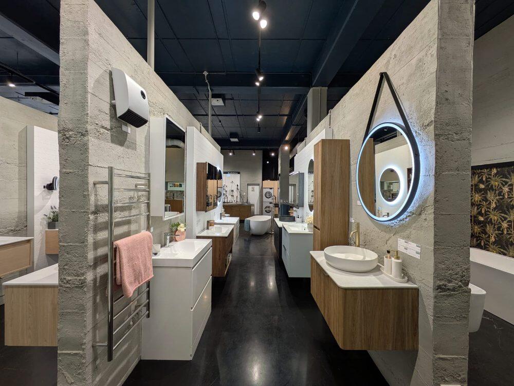 Vanities and basins on display along the showroom aisle