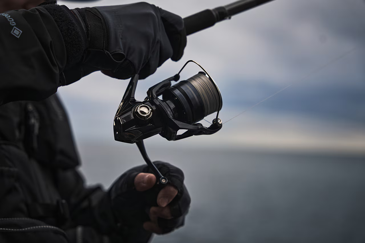 Shimano Twin Power XD Feature Image - Person reeling in a fish